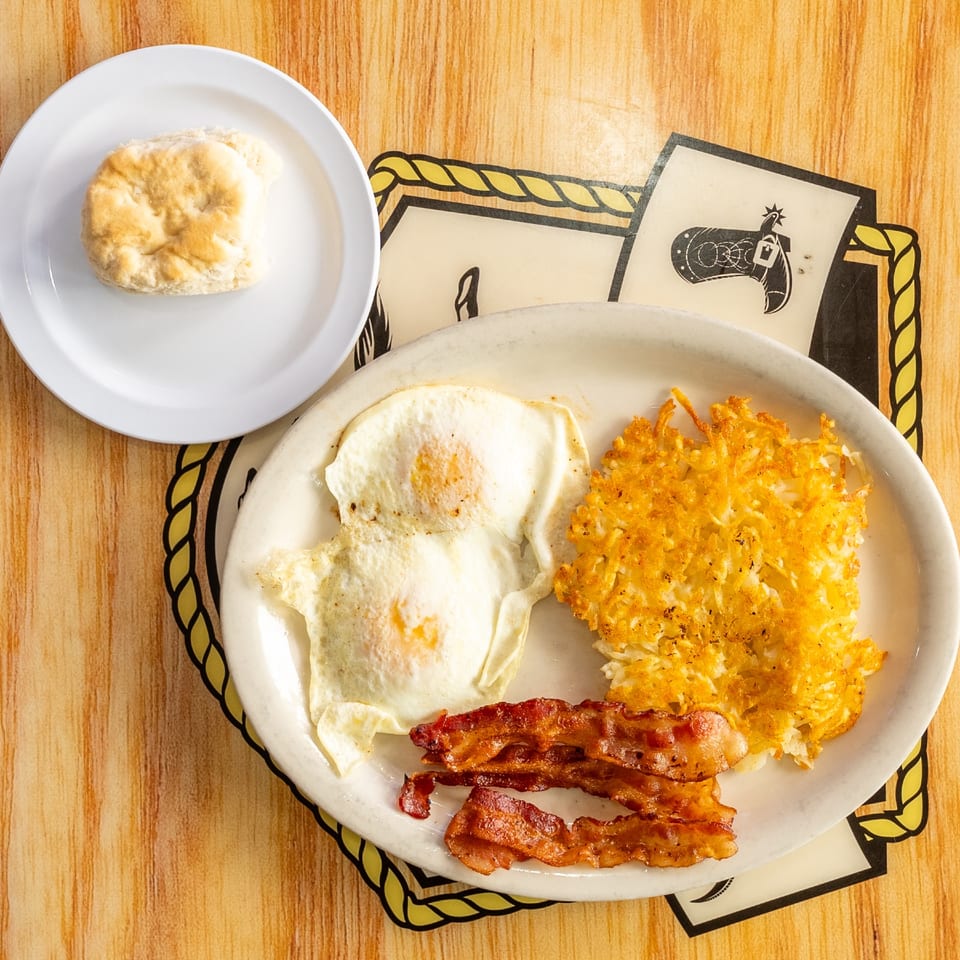 Eggs, bacon, hash browns, and a biscuit.